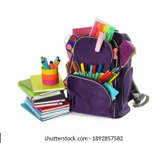 Purple backpack with different school stationery on white background