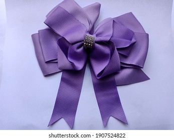 A Purple Big Ribbon Hair Clip For Girl And Woman