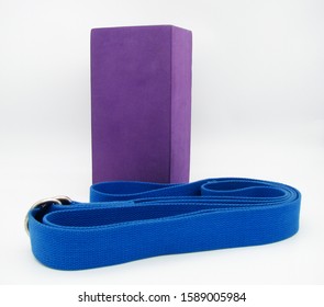 Purple Block And Blue Yoga Belt On White Background