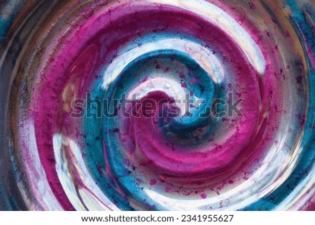 A purple and blue glass bowl swirl