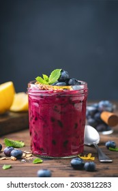 Purple Blueberry Smoothie In A Glass Jar, Dark Blue Chalk Background With Copy Space. Vegan Superfood Smoothie