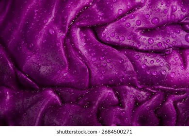 Purple cabbage texture background. Macro image of water drops on purple surface. Macro photo.
