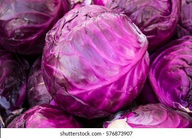 Purple cabbages stacked at a farmers' market - Powered by Shutterstock