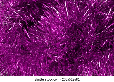 Purple Christmas garland shimmers with sequins close-up - Shutterstock ID 2085562681