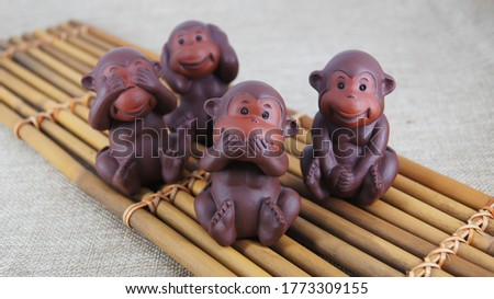 Purple clay art wise monkeys