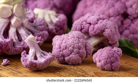 Purple colourful cauliflower on wooden rustic board. - Powered by Shutterstock