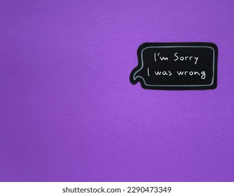 Purple copy space wall with handwritten text sticker I'M SORRY, I WAS WRONG, concept of to say sorry for making mistake, sincere apology to rebuild relationships with people you've hurt - Shutterstock ID 2290473349