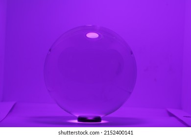 A Purple Crystal Ball On A Purple Background