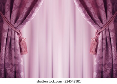 purple curtain background, with a  tassell.