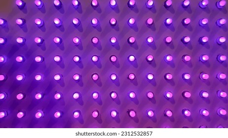purple Disco wall background in neon led dot lighting.pipes and lamps on the wall. light bulbs pattern.LED decoration lights idea on wall.modern decoration. - Powered by Shutterstock - Get 15% off with code: PIKWIZARD15