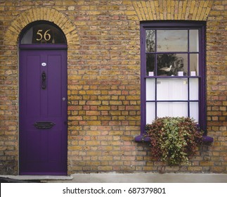 Purple Door And Window Of A Victorian House In London (UK). July 2017.