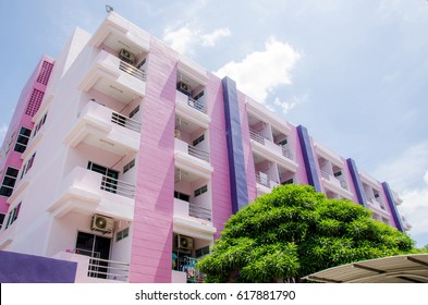 Purple Dormitory Building With Blue Sky Background.