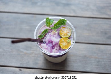 Purple Drink On Wood Table