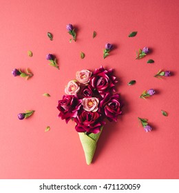Purple Flowers And Green Icecream Cone On Pink Background. Flat Lay.