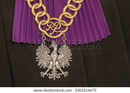 Purple fun in the dress of a court judge in Poland and a judge's chain