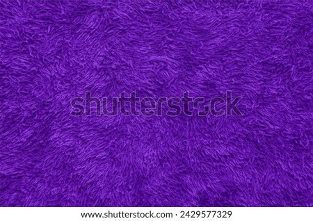 Purple fur texture top view. Purple sheepskin background