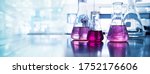 purple glass flask in blue research chemistry science banner laboratory background 