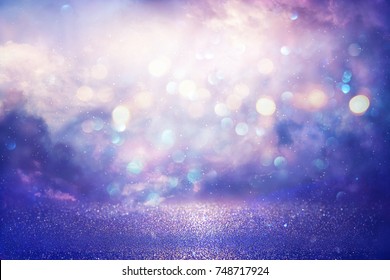 Purple Glitter Lights Background. Defocused