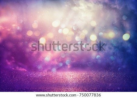 Purple glitter lights background. defocused
