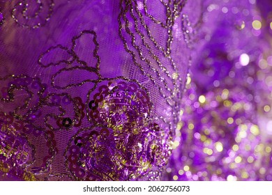 Purple Gold Bokeh Effect. Intricate Embroidery Of Beads And Sequins On Transparent Drape.