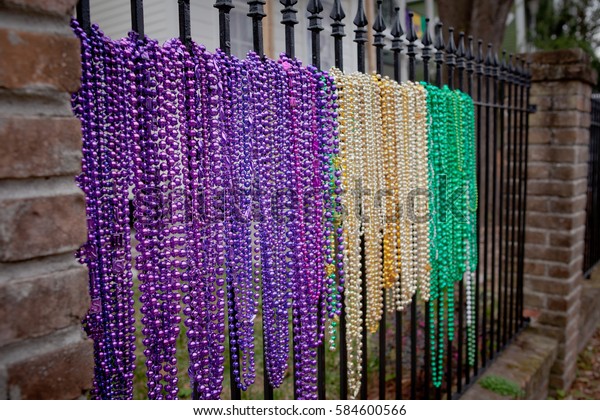 green and gold mardi gras beads