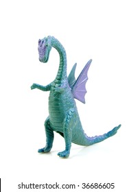 purple green plastic dragon toy isolated on white background