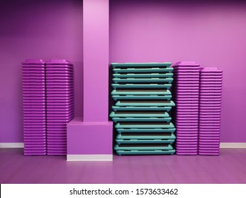 Purple And Green Sport Equipment On Purple Wall In Gym 