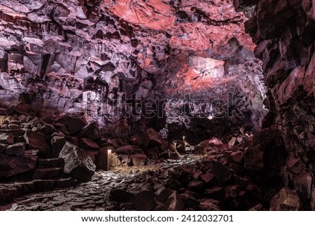 Purple illuminated rock structures of the underworld.