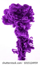 Purple Ink In Water Isolated On White Background