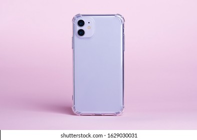 Purple IPhone 11 In Clear Silicone Case Back View Isolated On Pink Background. Phone Case Mockup 