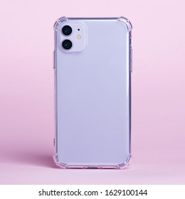 Purple IPhone 11 In Clear Silicone Case Back View Isolated On Pink Background. Phone Case Mock Up Close Up