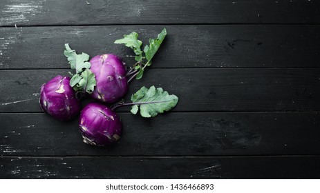 Purple kohlrabi cabbage. On a black background. Top view. Free space for your text. - Powered by Shutterstock