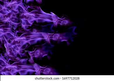 Purple lights in a black background. /Purple fire