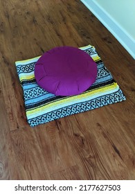 Purple Meditation Cushion On A Patterned Blanket. 