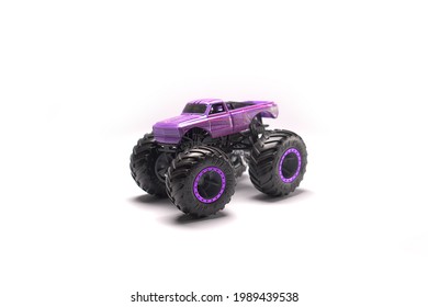 Purple Monster Truck Toy Car Big Wheels Diecast White Background Isolated