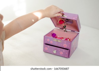 Purple Music Baby Jewelry Box With Ballerina. Children's Hand Opens The Lid