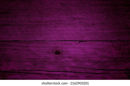 Purple Old Wood Texture Background. Close Up Violet Wooden Table Showing Rough Wood Grain And Wood Pith. Old Plank Lumber Wood. Colorful Wooden Background Grunge.