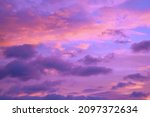  Purple orange pink sunset. Beautiful evening sky with clouds background for design.                              