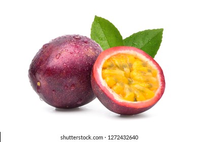 Purple passion fruit (Passiflora edulis) with cut in half and green leaf isolated on white background.
