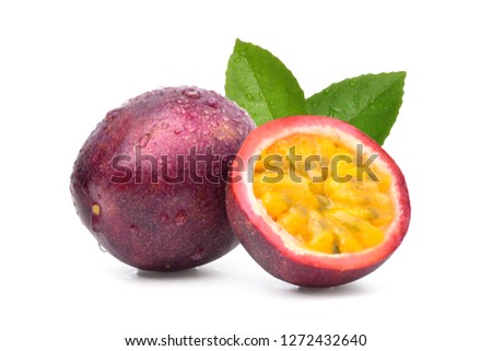 Purple passion fruit (Passiflora edulis) with cut in half and green leaf isolated on white background.
