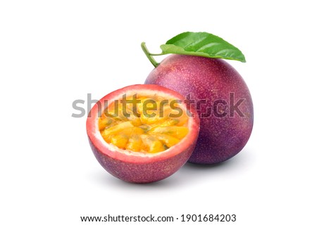 Purple passion fruit (Passiflora edulis) with cut in half and green leaf isolated on white background. Clipping path.
