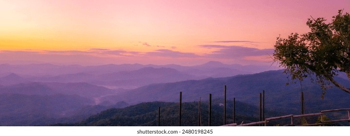 Purple pastel sky Romantic landscape sunrise foggy mountain in morning pastel tone.  Twilight Beautiful landscape foggy hills violet beautiful Purple sky sunset dramatic landscape mountain cloudscape