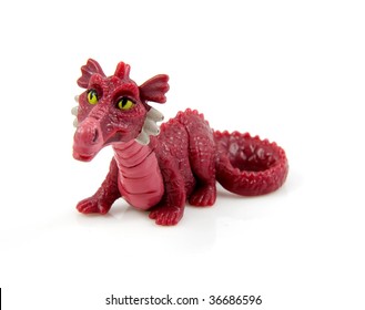 purple plastic dragon toy isolated on white background