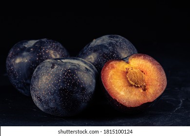 Purple Plum On Black Background