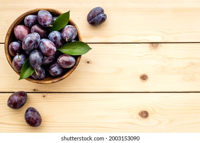 Purple Plums In Bowl. Plum Harvest Top View