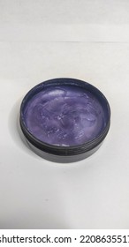 Purple Pomade In A Plastic Container