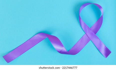Purple Ribbon On Blue Background ADD,ADHD,Alzheimer Disease ,Arnold Chiari Malformation,Childhood Hemiplegia Stroke, Epilepsy, Chronic Acute Pain,Crohns