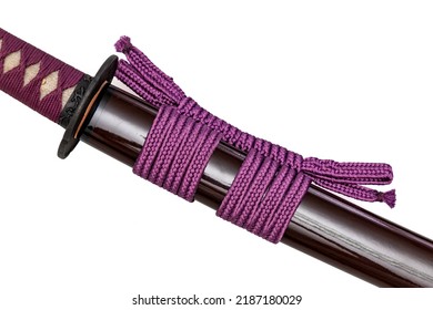 Purple Sageo : Purple silk rope for tying. Shining purple Japanese scabbard isolated on a white background. Selective focus.