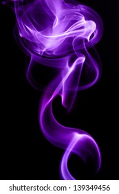 Purple smoke in black background