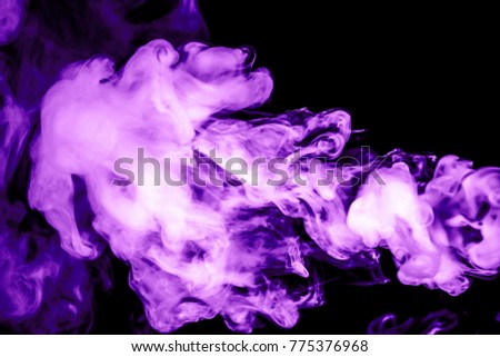 purple smoke isolated on a black background. fractal. spiral.
